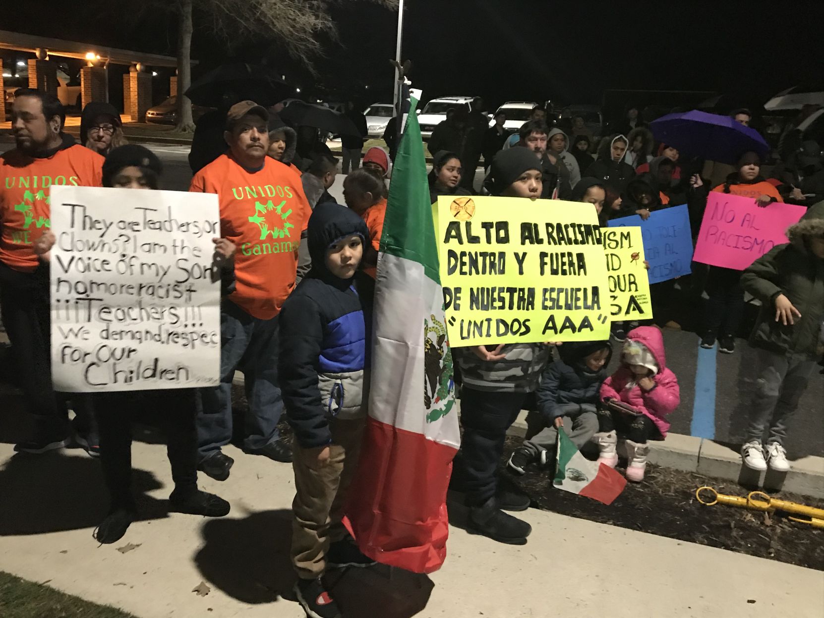 Participants at a rally at Academia Antonia Alonso Charter School hold signs on Wednesday, February 12, 2020